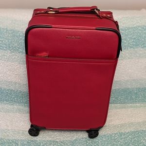 Michael Kors red rolling suitcase